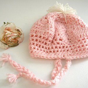 Cute hand crochet baby hat with braided ties